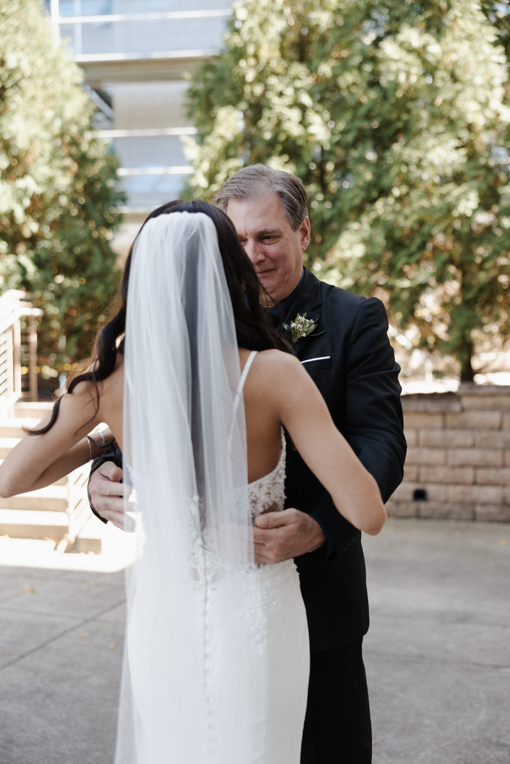Father crying during father daughter wedding first look