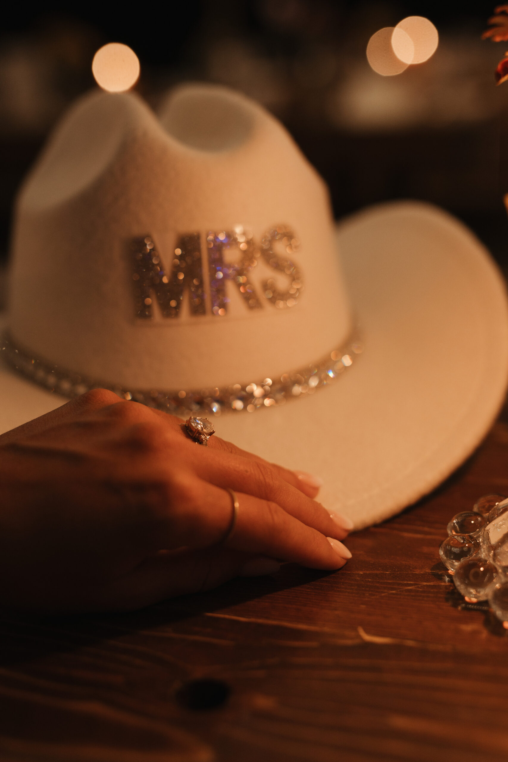 A bedazzled cowboy hat that reads "Mrs"