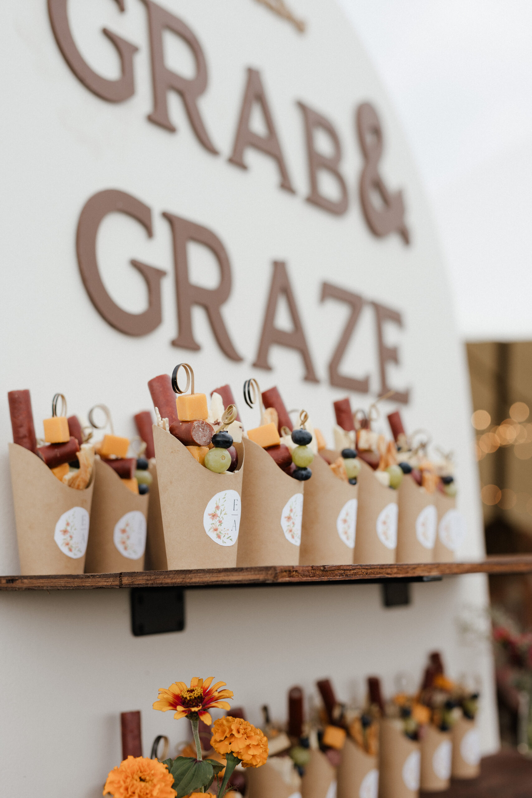 A charcuterie cup setup for a backyard wedding