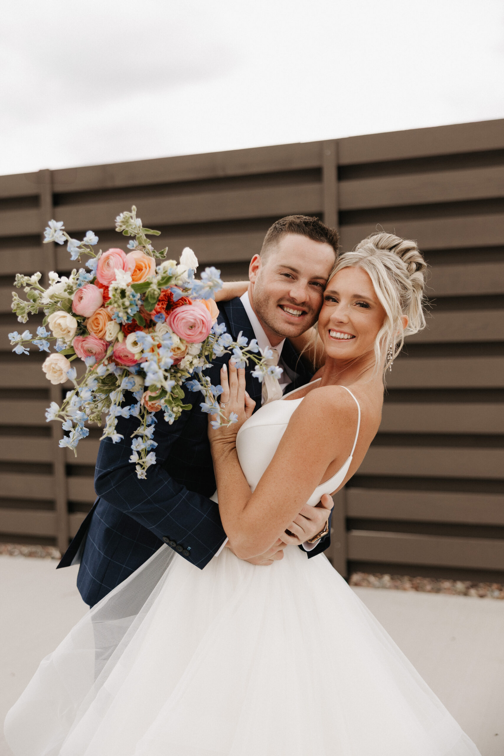 A couple hugging during wedding photos at The Valerie