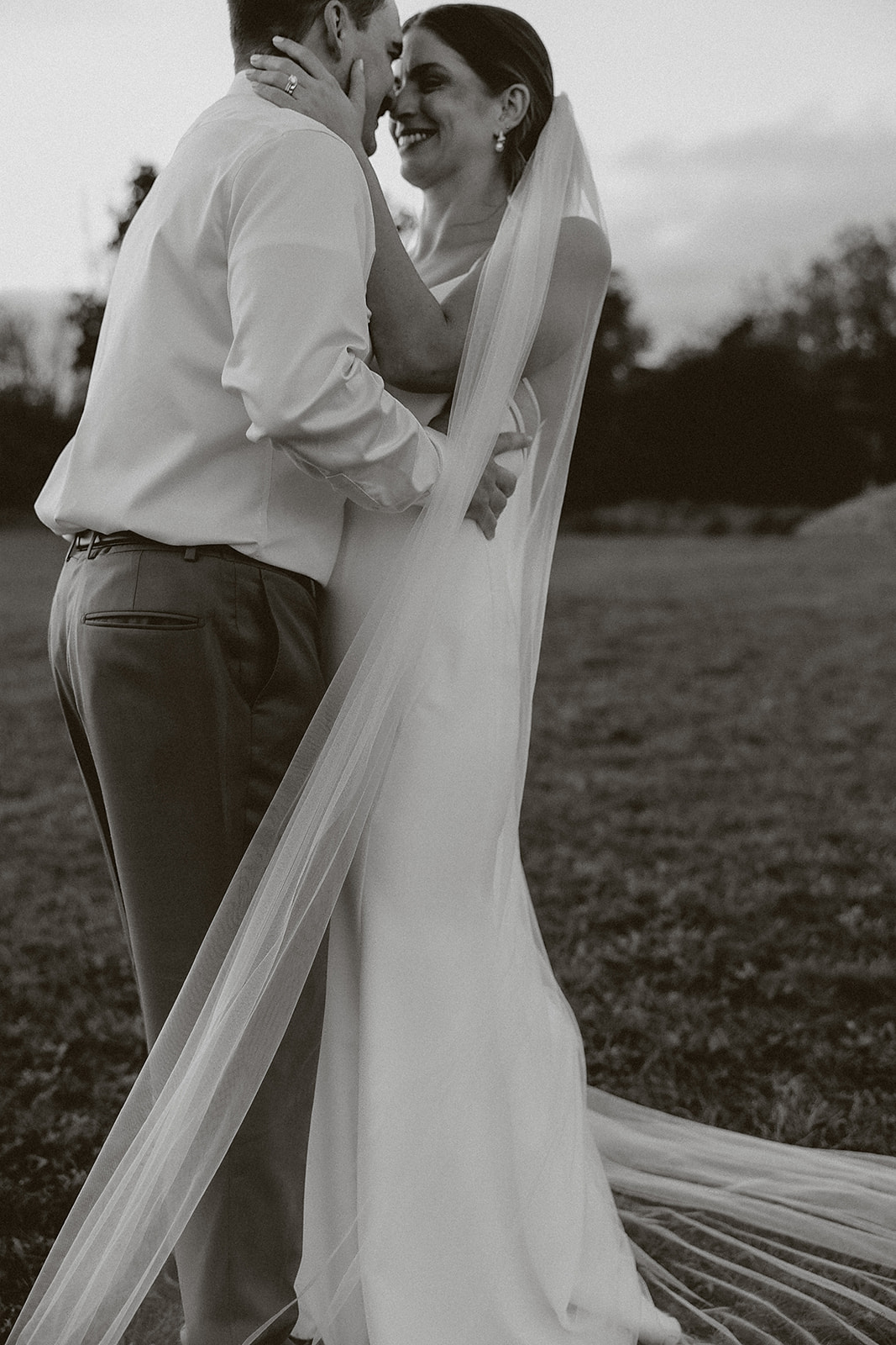 A couple laughing in a priceless wedding photo
