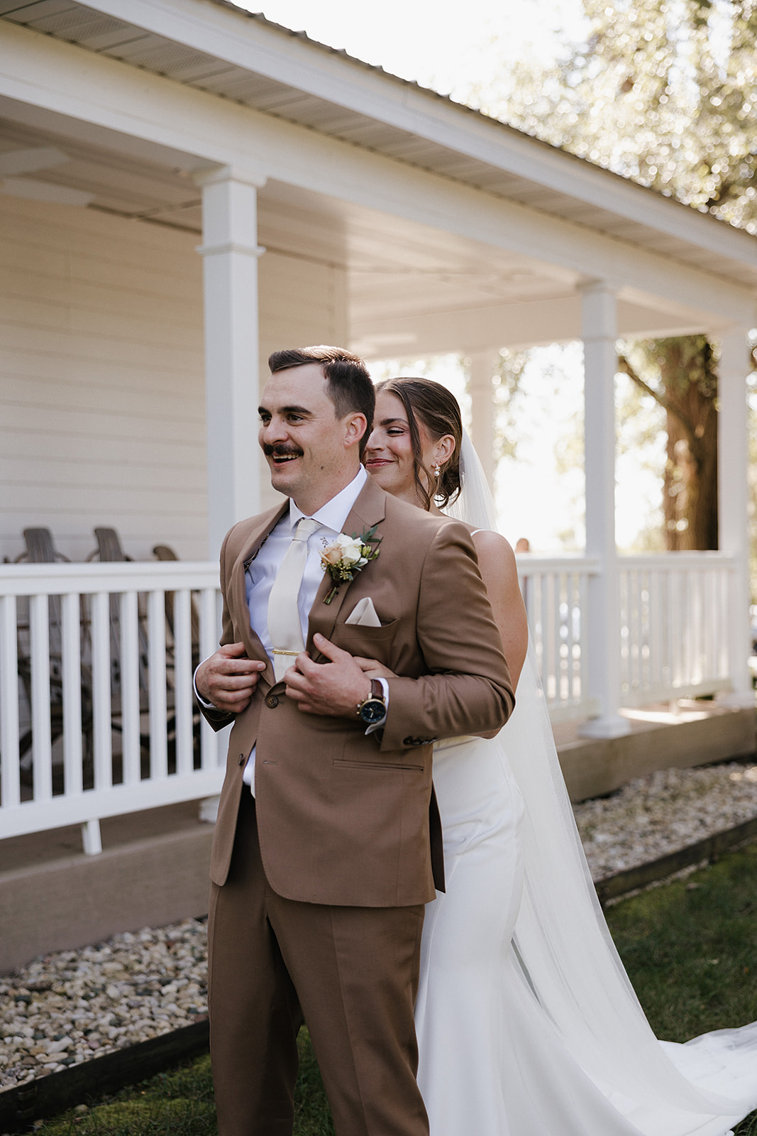 A bride and groom preparing for a first look in a wedding blog post answering the question "how much does wedding photography cost?"