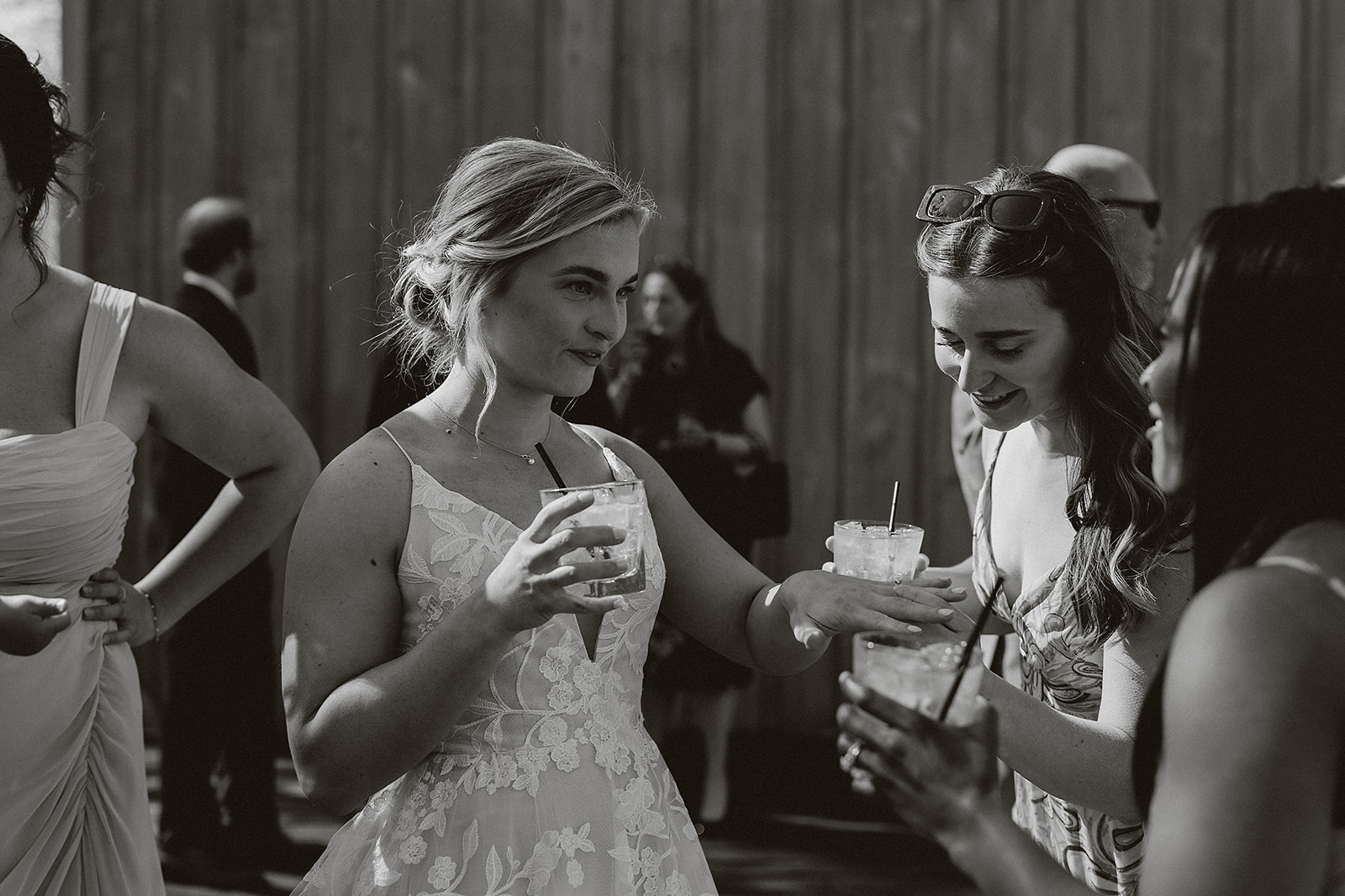 A bride mingling with guests at a wedding cocktail hour