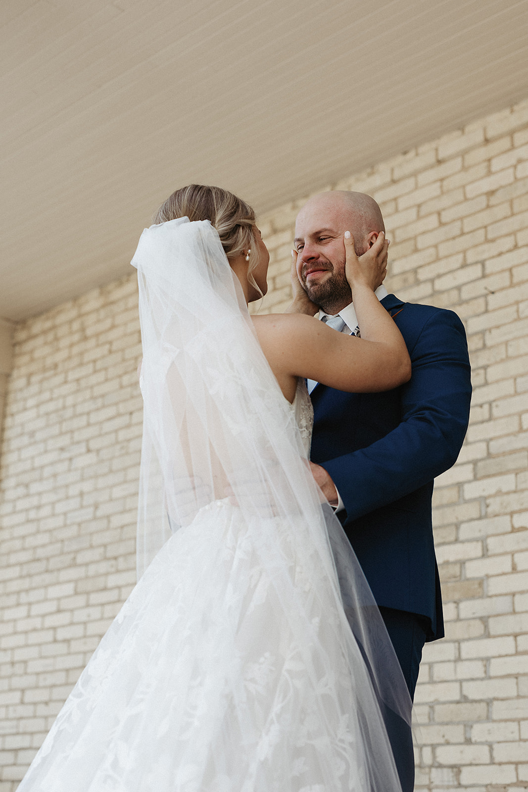 A bride and groom taking wedding portraits