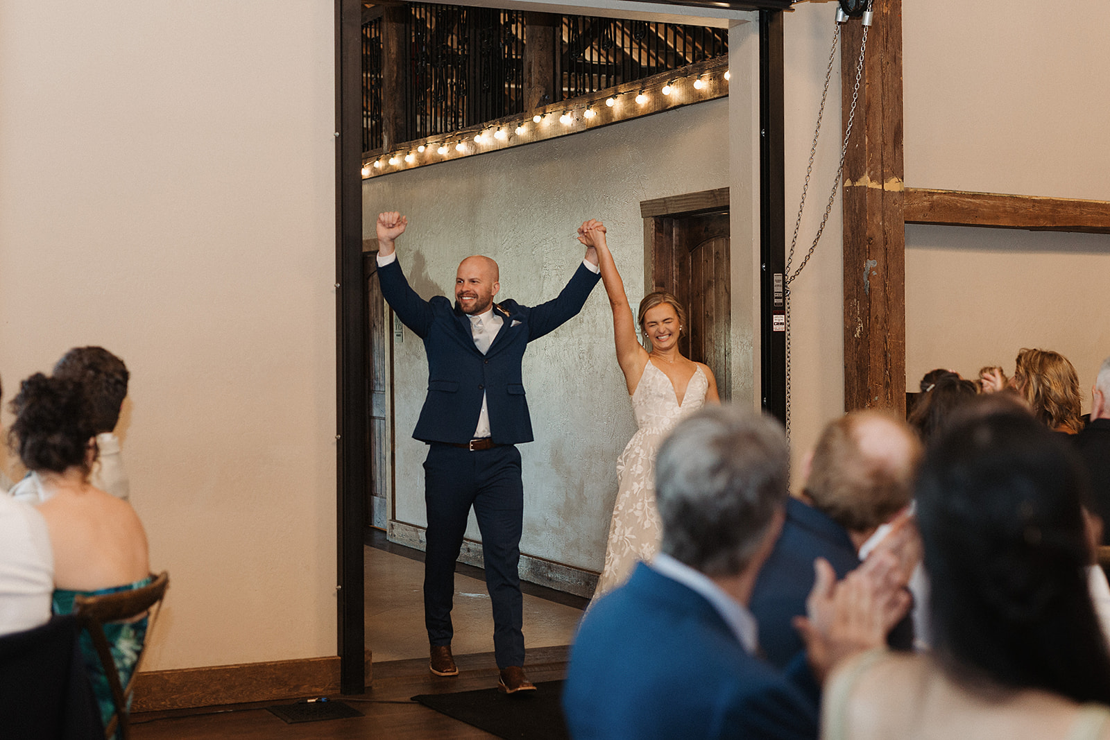 A bride and groom making their grand entrance on their wedding reception timeline