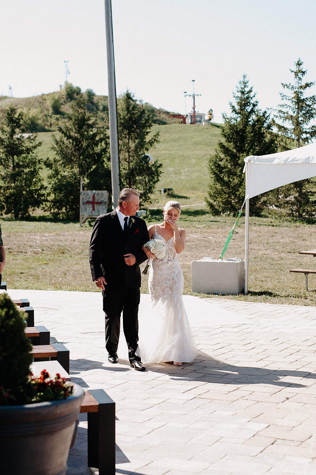 A bride walking down the aisle with her dad