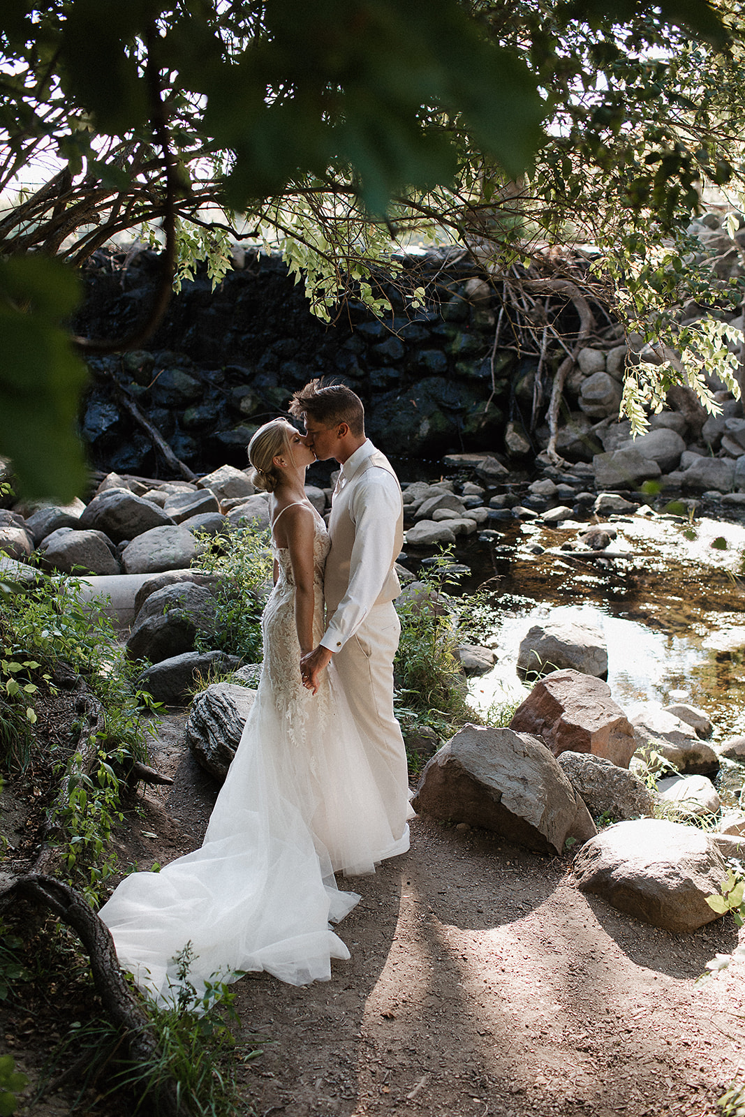 A bride and groom kissing in wedding photos taken by a Milwaukee wedding photographer