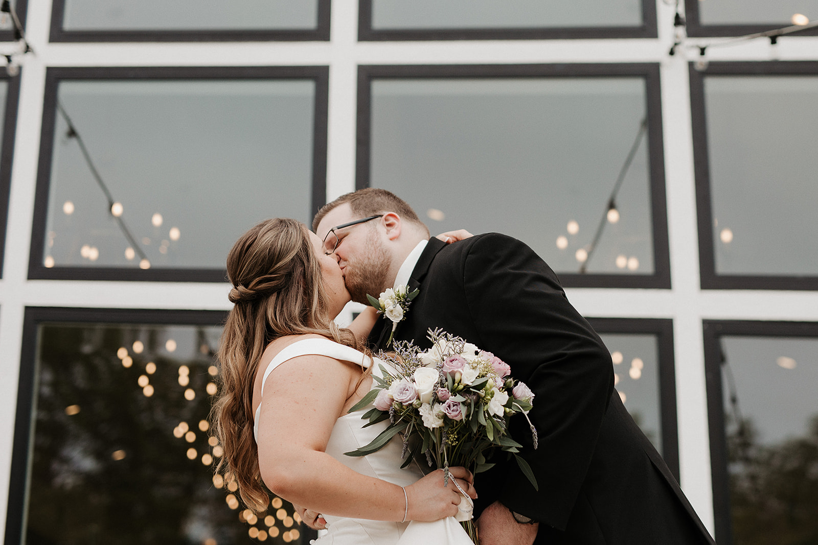A bride and groom posing for wedding photos at the Eloise