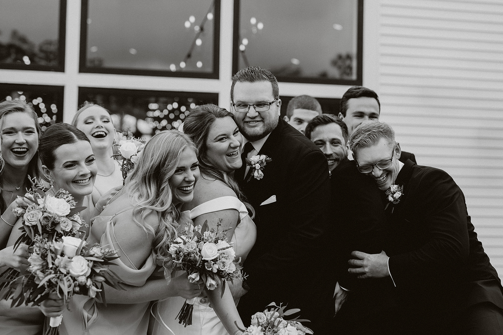 A black and white photo of a wedding party