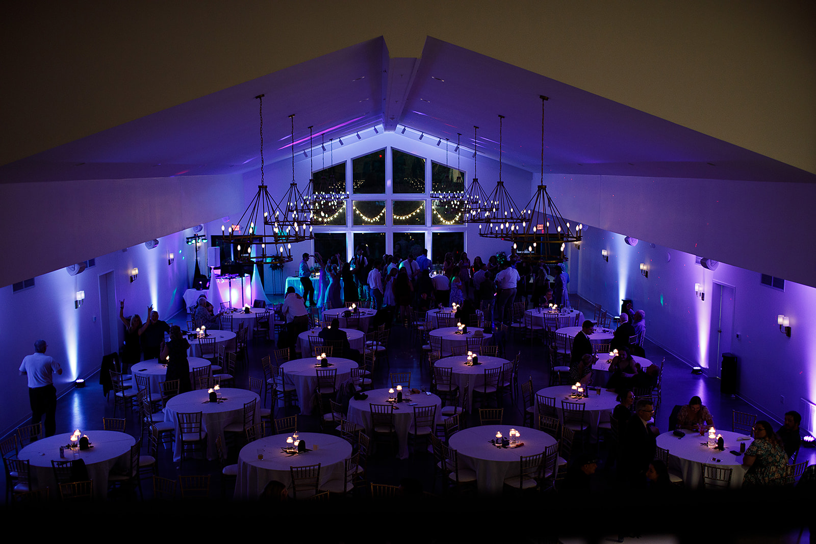 A purple-lit wedding reception at the eloise