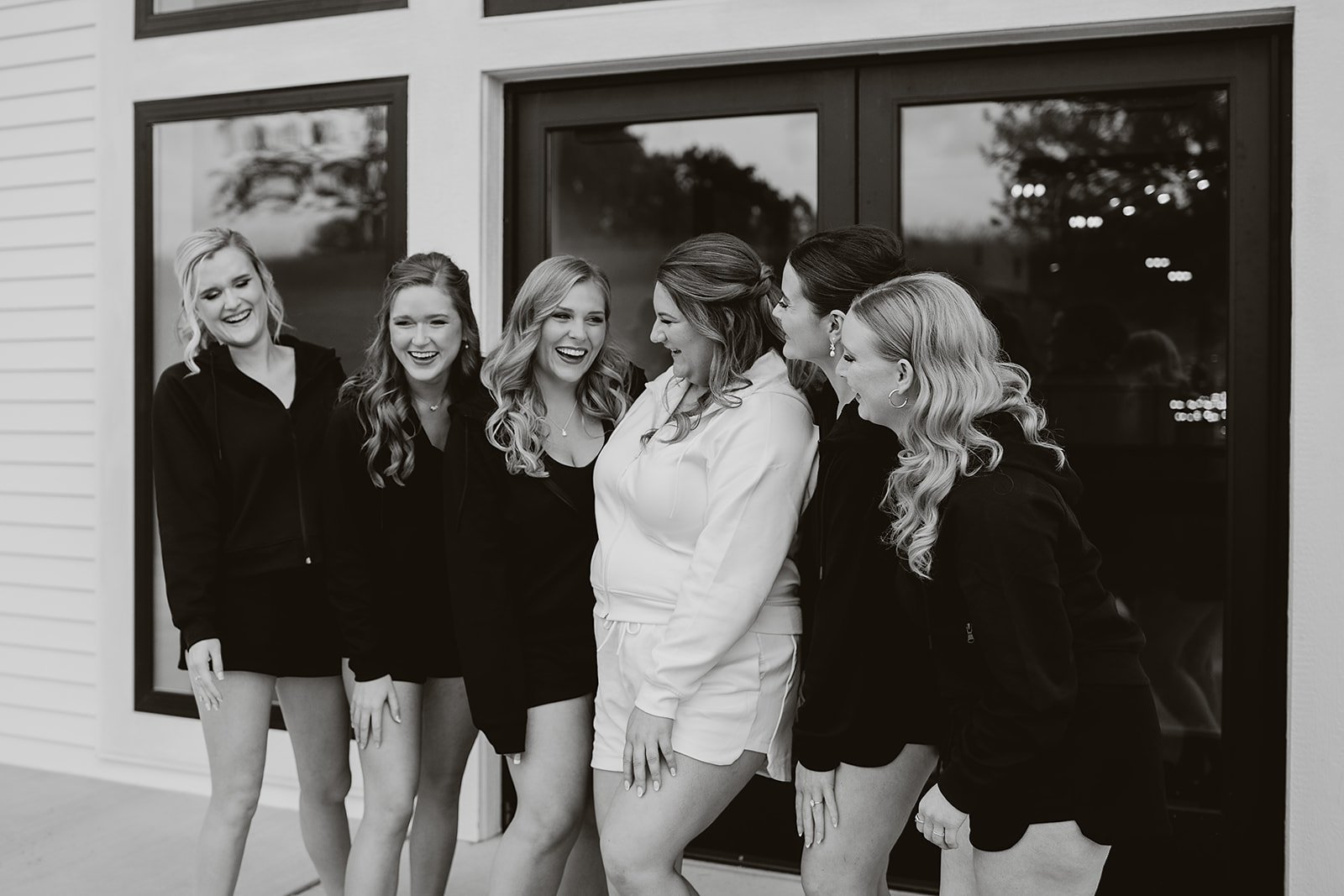A bride and bridesmaids taking getting ready photos