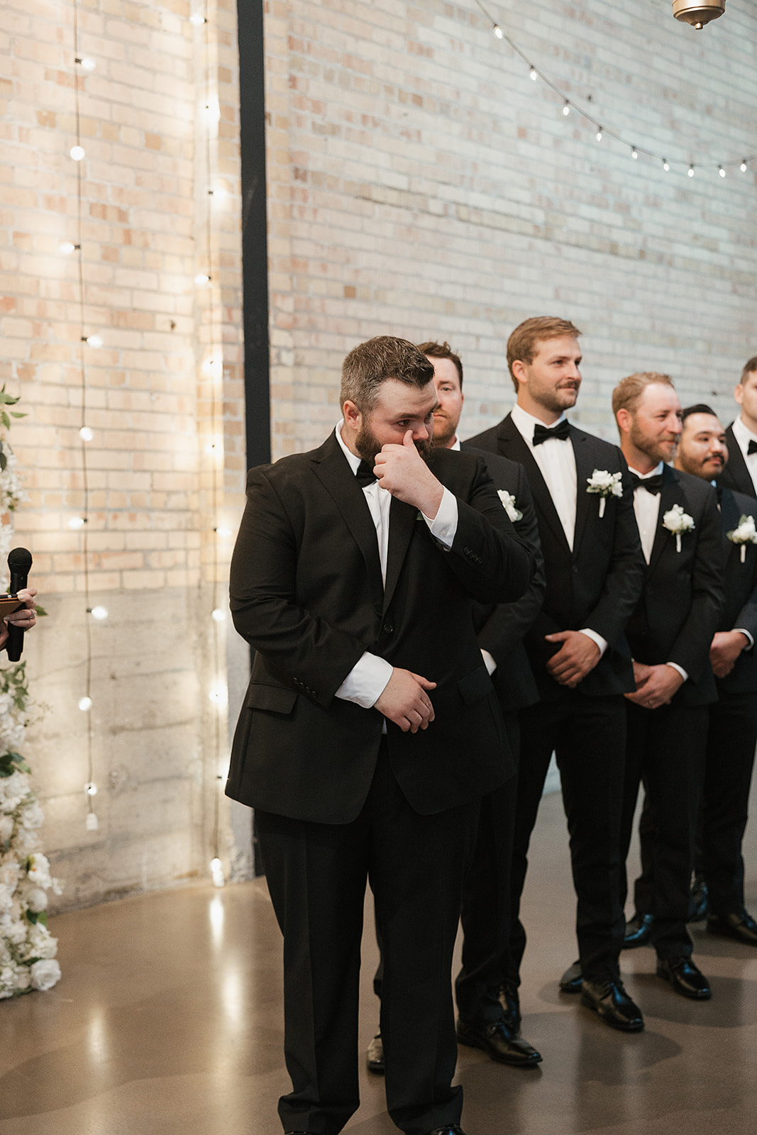 Groom reacts to bride walking down the aisle