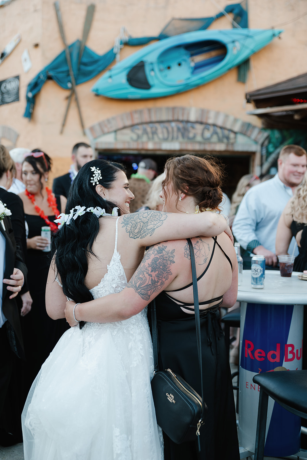 Bride hugging guests during lively moment