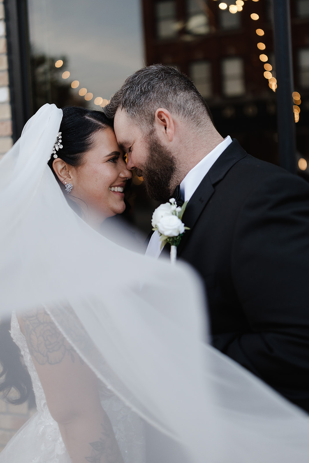 Romantic veil moment with bride and groom